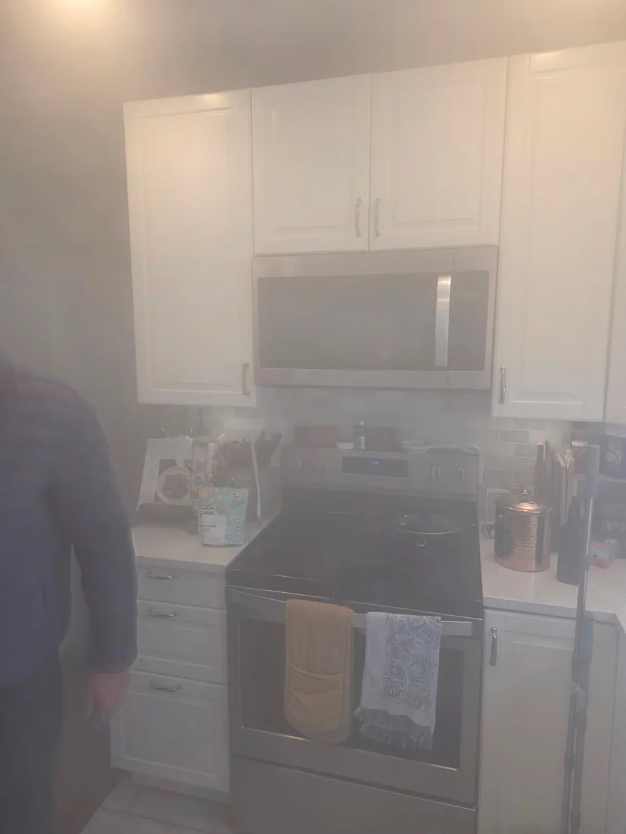 A kitchen mid-treatment with cabinets and contents left in place